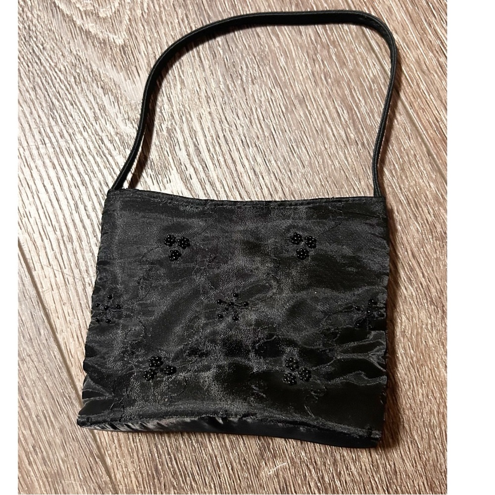 Claire’s Small black purse with beaded flower detailing